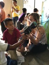 Kat teaches children about Doña Zancudo